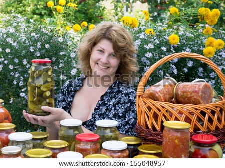 Woman with home canning for the winter
