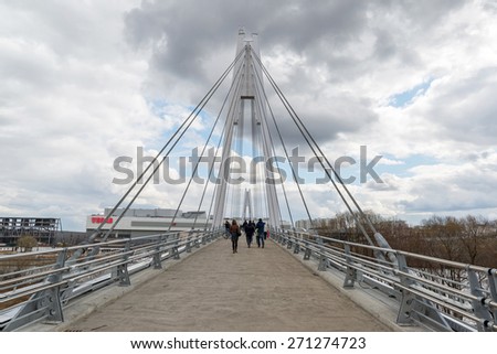 Krasnogorsk, RUSSIA - April 18,2015. Pedestrian bridge is built from two pylons, measuring 41 m tall. Pylons are connected to spans with help of 28 straight cable wires, which hold up suspension spans