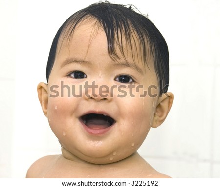 asian baby taking a bath