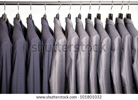 Business suits hanging on a rack