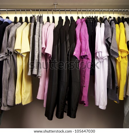 Colorful shirts on display in a fashion store.