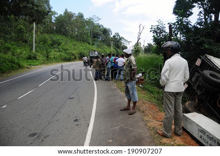 HAPUTALE; SRI LANKA - JANUARY 22: Road accident in Haputale. Traffic accident January 22, 2014 in Haputale, Sri Lanka.A truck was going down at hight speed and loose control on a curve
