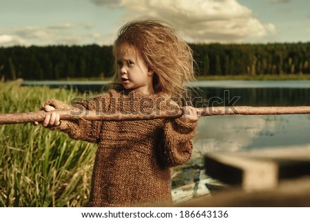 portrait of a beautiful young girl on nature, art photo of a child
