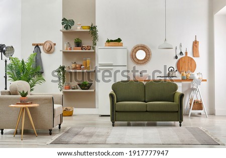 Decorative living room and kitchen background interior style, green sofa and armchair middle table, brown bookshelf and dining table style.