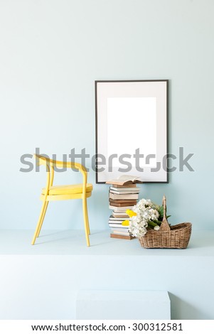 blue wall interior style with yelow chair