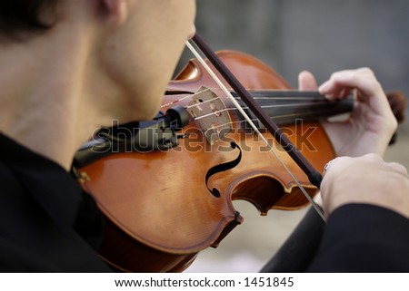Image of a young man playing the violin