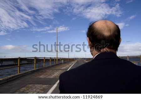 Image of a man from behind.