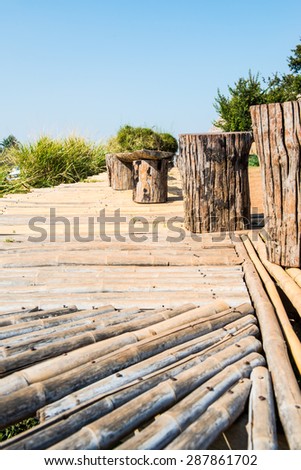 Wood bench with bamboo floor on Mon Jam hilltop at Chiangmai province, Thailand.