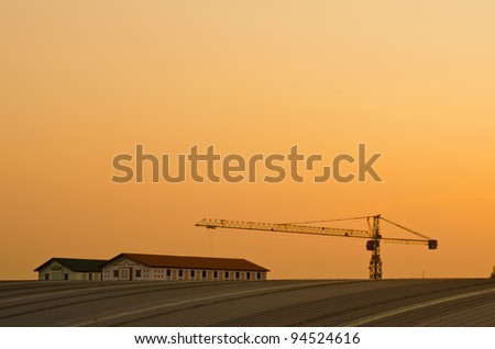 Tower crane and tower on roof, Thailand.