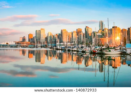 Beautiful view of Vancouver skyline with harbour at sunset, British Columbia, Canada