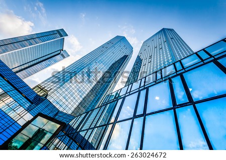 Similar – Image, Stock Photo Bottom view of skyscraper building against gray sky and clouds. Looking up view in apartment building in the city. Real estate and corporate construction. Multi-storey residential building. Condo.