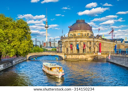 Beautiful view of UNESCO World Heritage Site Museumsinsel (Museum Island) with excursion boat on Spree river, Berlin, Germany