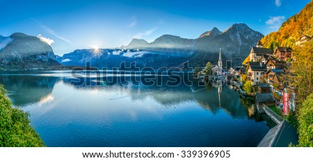 Scenic panoramic picture-postcard view of famous Hallstatt mountain village with Hallstatter See in the Austrian Alps in beautiful golden morning light in fall, Salzkammergut, Austria Stock fotó © 