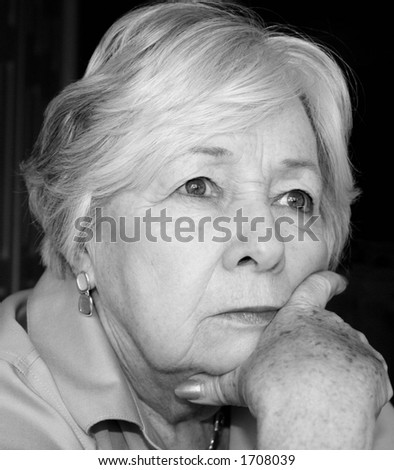 Pensive older woman in black and white