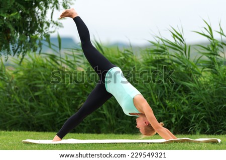 Exercising downward facing dog yoga pose