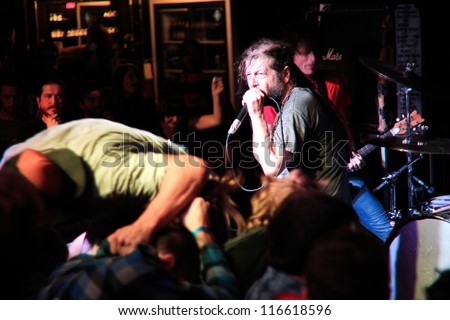 TORONTO, CANADA - OCT 23 2012: Keith Morris, original singer of punk rock pioneers Black Flag and Circle Jerks, performing live with his band OFF! at Wrongbar in Toronto, Canada October 23 2012.