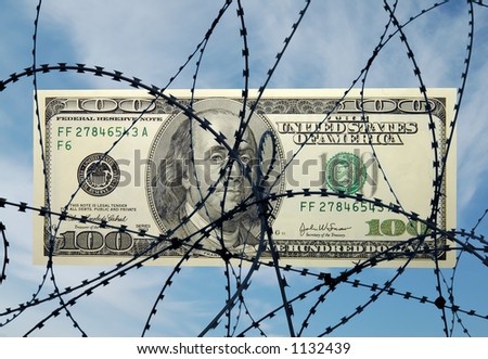 One hundred dollar bill behind the wire