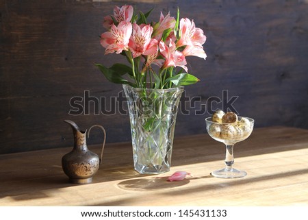Pink flower bouquet on wooden tabletop