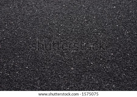 Black sand closeup background