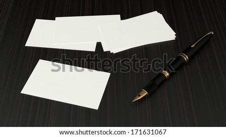 few blank white visit card on dark wooden surface