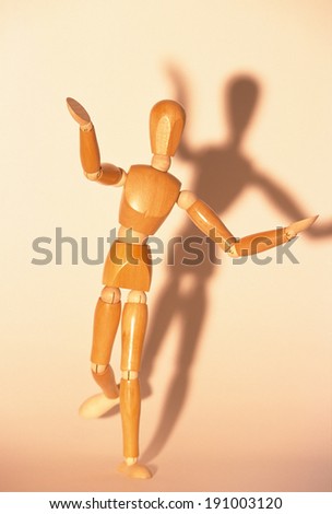 Artists mannequin standing on one leg