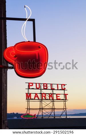 SEATTLE, WASHINGTON/UNITED STATES - SEPTEMBER 2: Neon Public Market sign and steaming cup of coffee in Pike Place Market in Seattle, Washington on September 2, 2012.