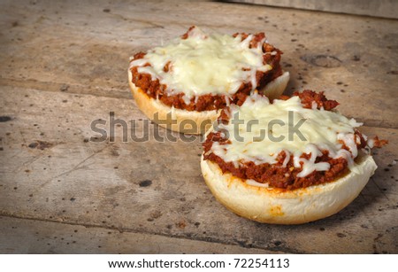 Two Pizza Burgers on old vintage wood table with copy space
