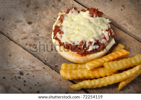 Pizza Burger with French Fries on old vintage wood table with copy space