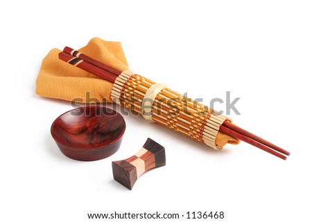 Wooden chop sticks, sauce cup, sticks holder and napkin isolated on a white background