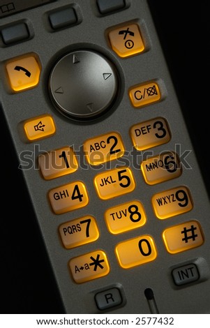 Closeup view of a cordless phone with illuminated keypad