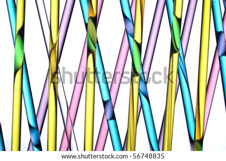 Close up of glass straws with colored liquid