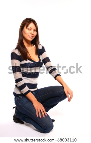 Pretty Asian Model Kneeling On Floor In Studio Stock Photo 68003110 ...