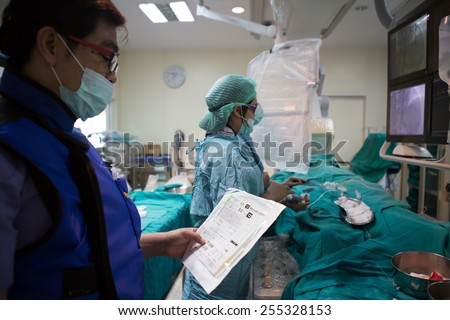 BANGKOK,Thailand-February:16, 2015:The doctor and staff are treating with Angiography,this is a medical imaging technique used to visualize the inside of blood vessels