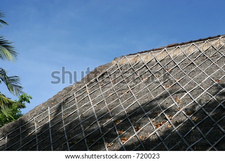 old thatched roof of tropical villa in bali