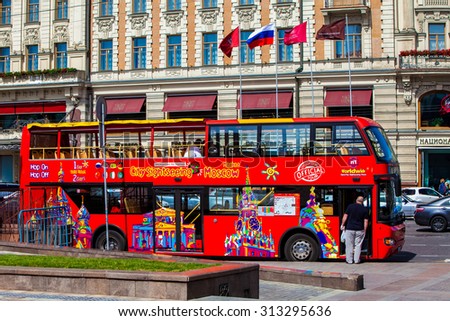 MOSCOW, RUSSIA - JULY 03, 2015: Red double-decker tour bus on Moscow street.  Hop On-Hop Off tour bus offers excursions in eight languages