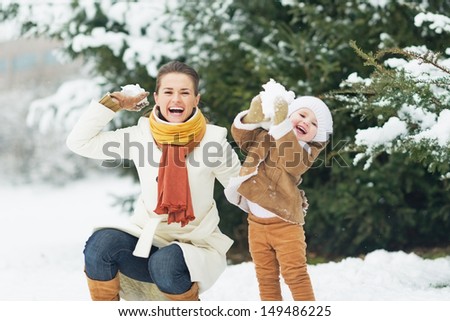 Similar – Image, Stock Photo Woman throwing snow in snowy landscape in winter.