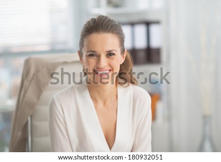 Portrait of smiling modern business woman in office
