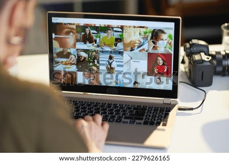 Similar – Image, Stock Photo Female photographer working on photos on laptop and camera