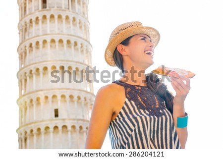 A slice of pizza by the Leaning Tower of Pisa. It doesn\'t get much more authentic than that, does it?
