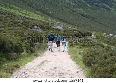 family walking in the countryside