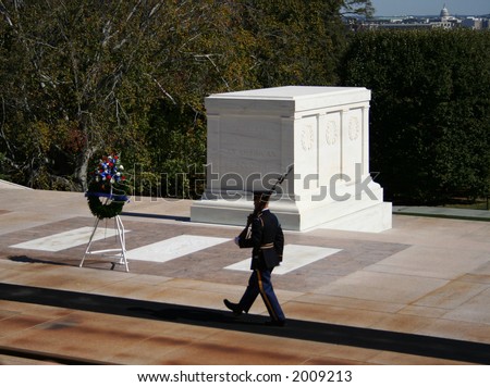 Tomb of the unknown soldier Arlington cemetery with honor guard marching