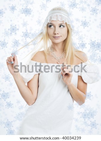 portrait of beautiful blonde with drawn snowflakes