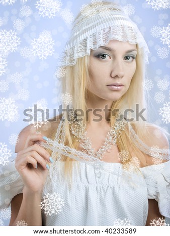 portrait of beautiful blonde with drawn snowflakes