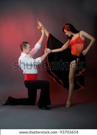 passion latin dancers over grey background