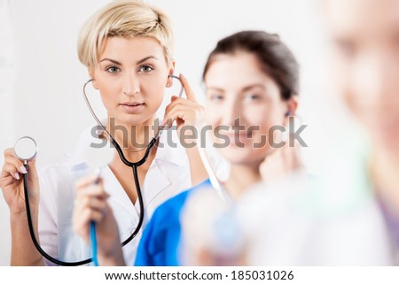 Doctors team with stethoscopes in hands