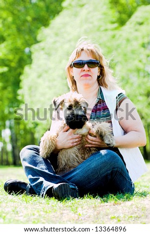 Irish soft coated wheaten terrier and woman