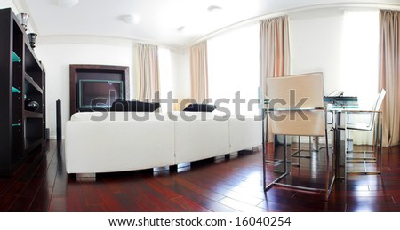 Dining room interior with white sofa, tv and table