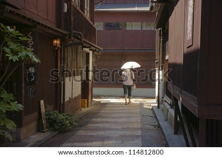 JAPAN-SEPTEMBER 7: Unidentified women walk along  Higashi Chaya district  on September 7, 2012  Kanazawa Japan. Higashi Chaya district, where geisha have been entertaining people.