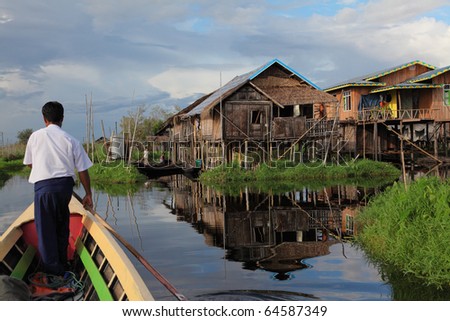 MYANMAR,BURMA-OCTOBER-15: Wooden stilt houses village in the water on October 15, 2010 Inle lake Myanmar. Inle lake the favorite attractions for tourists who like the traditional view of life.