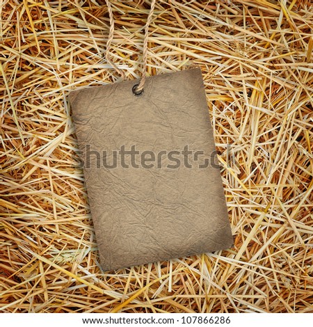 Straw texture background with cardboard label